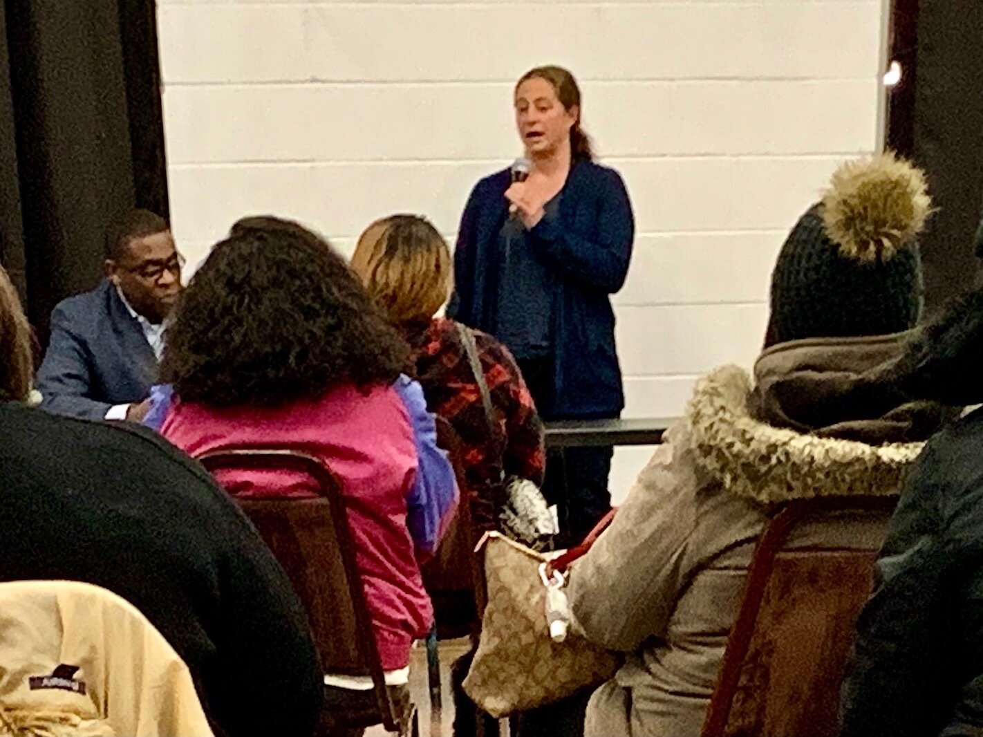 Kalamazoo City Planner Christina Anderson explains Kalamazoo’s new Emergency Housing Ordinance during a meeting on housing Tuesday evening (Dec. 7, 2021) at the Northside Association for Community Development.