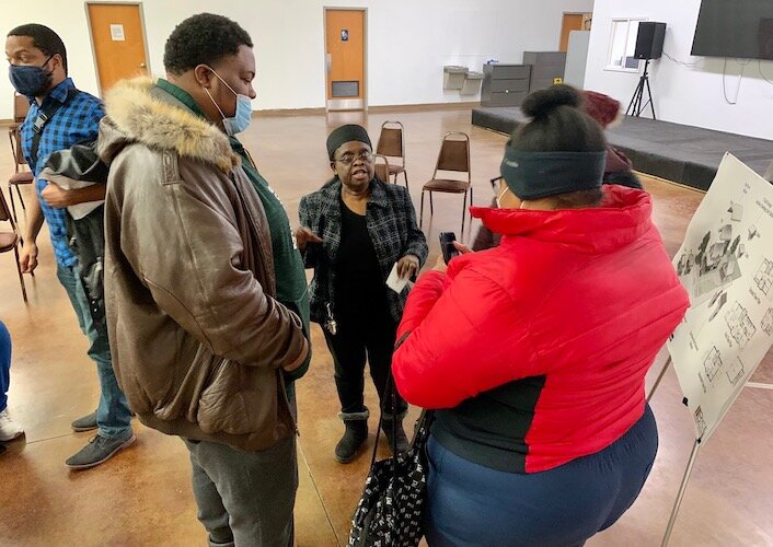 NACD Executive Director Mattie Jordan-Woods, center, says home ownership is a building block of wealth and will help more residents of her community become financial stable.