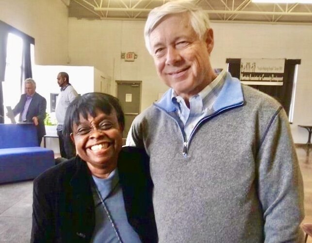 Mattie Jordan-Woods, left, is visited by U.S. Rep. Fred Upton as he announces $2 million in federal funding to help develop affordable single-family housing in Kalamazoo’s Northside Neighborhood.