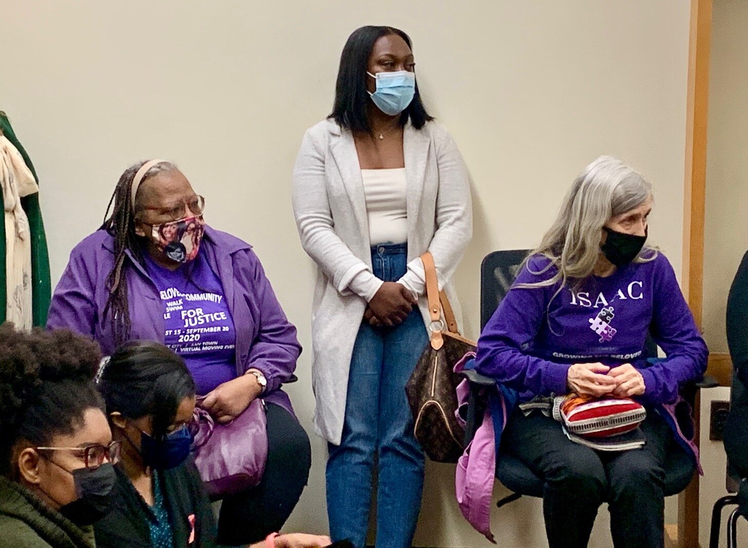 Kalamazoo County Commissioner Tami Rey stands among supporters at a Wednesday morning meeting of the Kalamazoo County Election Commission.