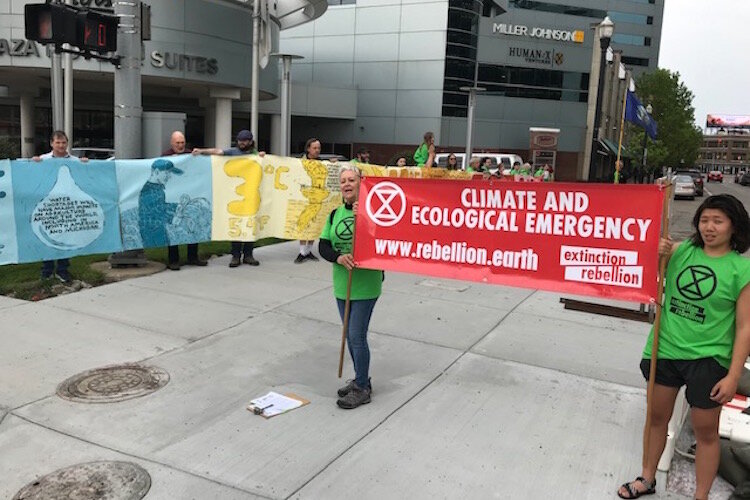In Extinction Rebellion's first action, members participated in a march from Bronson Park to the Radisson Hotel.