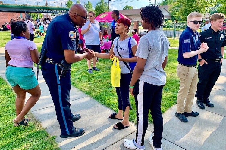 Vernon Coakley, chief of the Kalamazoo Department of Public Safety, talks with people during the Northside Neighborhood’s 2021 National Night Out event. He describes it as “a great opportunity for our community to get out, and meet and greet one anot