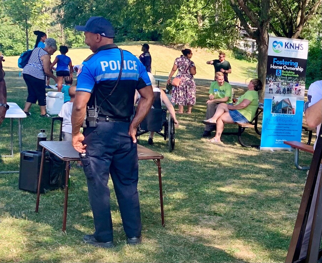 A Kalamazoo Public Safety officer mingles with Eastside residents during the Kalamazoo Eastside Neighborhood Association’s 2022 National Night Out. Photo by Al Jones