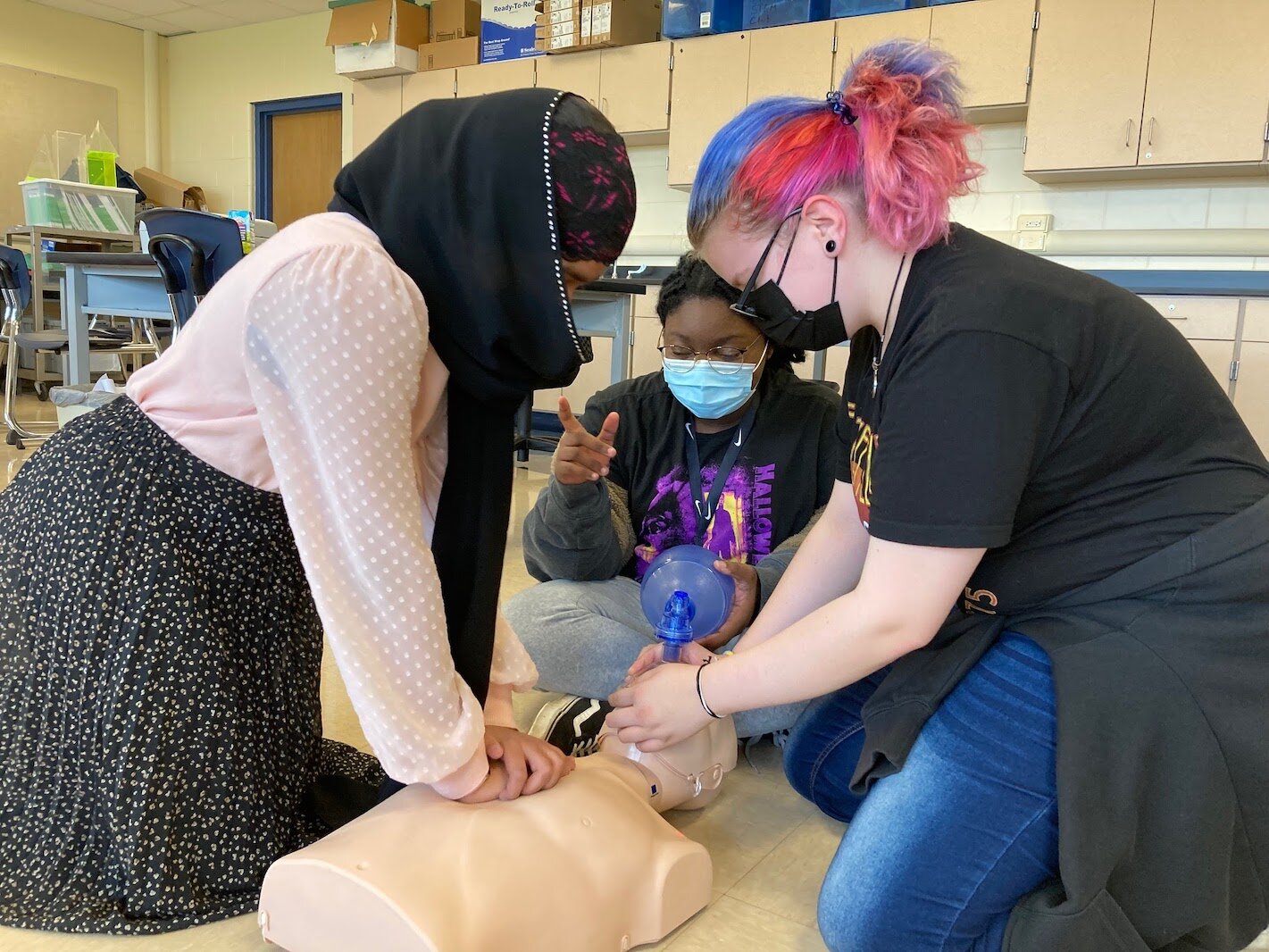 Early Introduction to Health Careers - Milwood Magnet School participants are, from left, Eman Fatima (6th grade), Mutisunge Kadaluka and Zoe Freed both 8th graders.