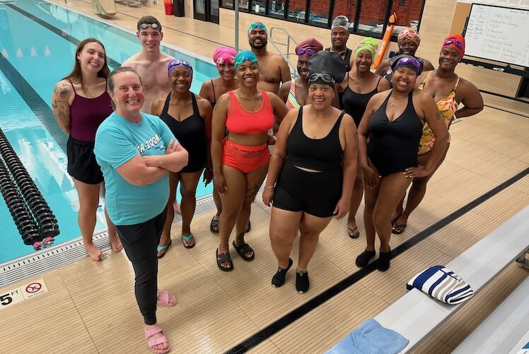 Allison McKenna, lead instructor, stands with the July cohort of the Kalamazoo Masters Swim Club Adult-Learn-to-Swim program.