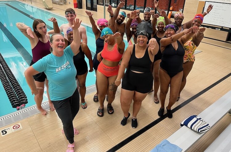 Allison McKenna, lead instructor, stands with the July cohort of the Kalamazoo Masters Swim Club Adult-Learn-to-Swim program.