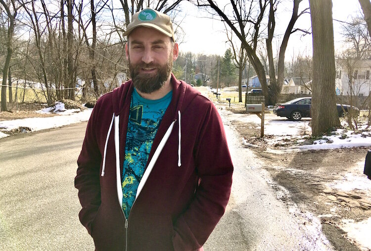 Andrew Richmond takes pride in some of the exterior fix-it work that helped him get to know some of his neighbors a few years ago.