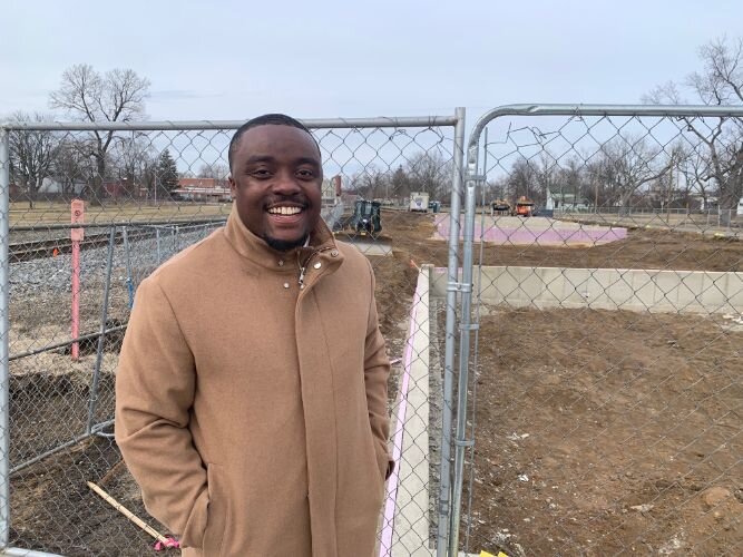 Former Western Michigan University football player Jamauri Bogan stands on Feb. 20, 2023 in front of the 315 E. Frank St. site on which he is developing a residential and commercial project called Zone 32.