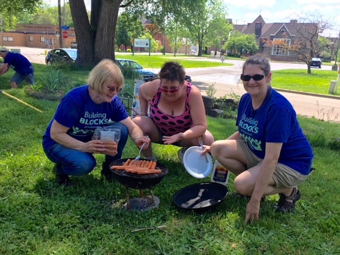 Breaking bread together is one way of building community on a Building Blocks project.