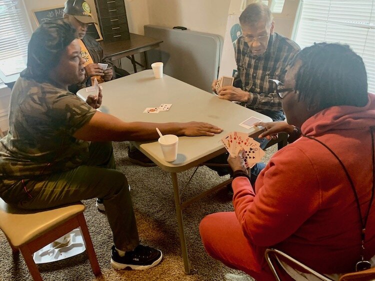 Peer support counselor Gwen Lanier, right, enjoys Monday-afternoon fellowship gatherings at Mothers of Hope.