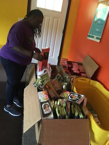 Takisha Johnson gets ready for the Teen Hair Clinic where she teaches that every queen must care for her crown.