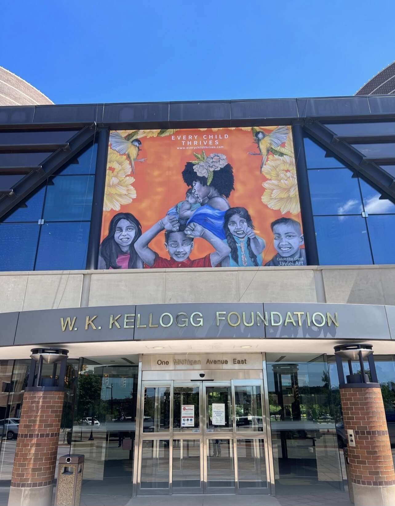 An art  banner created by Taylor during "Color the Creek" was displayed at the entrance to the W.K. Kellogg Foundation.