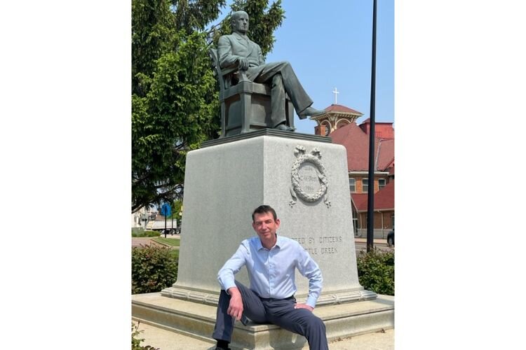 Mac McCullough ata statue and historical  marker honoring C.W. Post. 