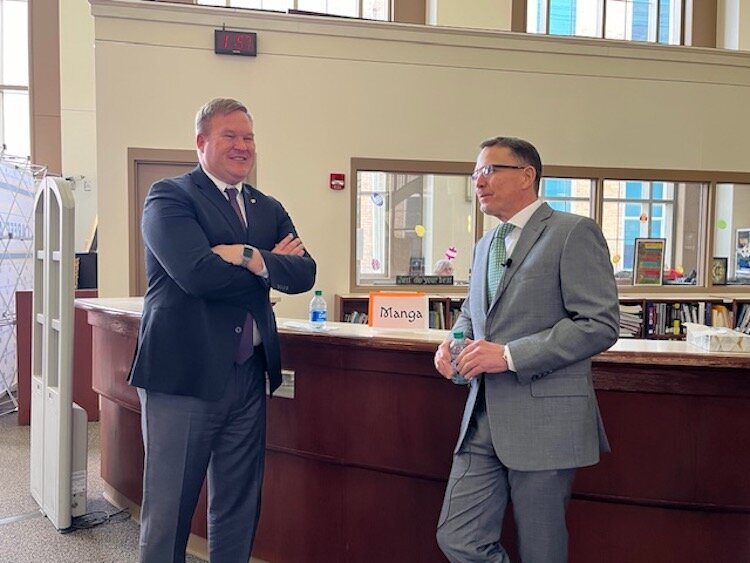 Dr. Wayne Webster, Albion College President, at left, and Robert Bartlett, President of Michigan Colleges Alliance