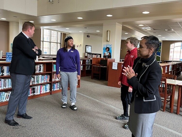  From left to right: Albion President Dr. Wayne Webster, students DeVoine Newton and Noah Nichols, and Dr. Kimberly Carter, Battle Creek Superintendent.