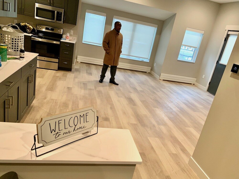 Developer Jamauri Bogan stands inside a two-bedroom apartment at Zone 32.