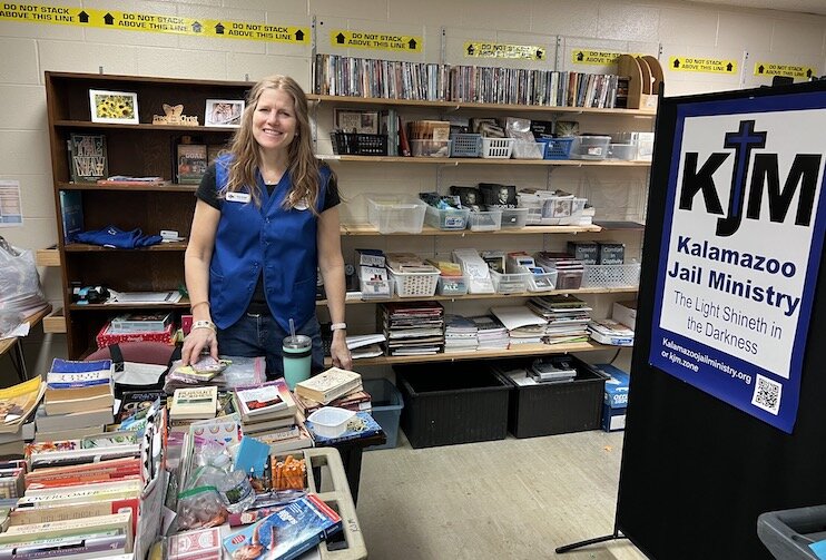 Amy Grupp, co-founder of Kalamazoo Jail Ministry, in the KJM library