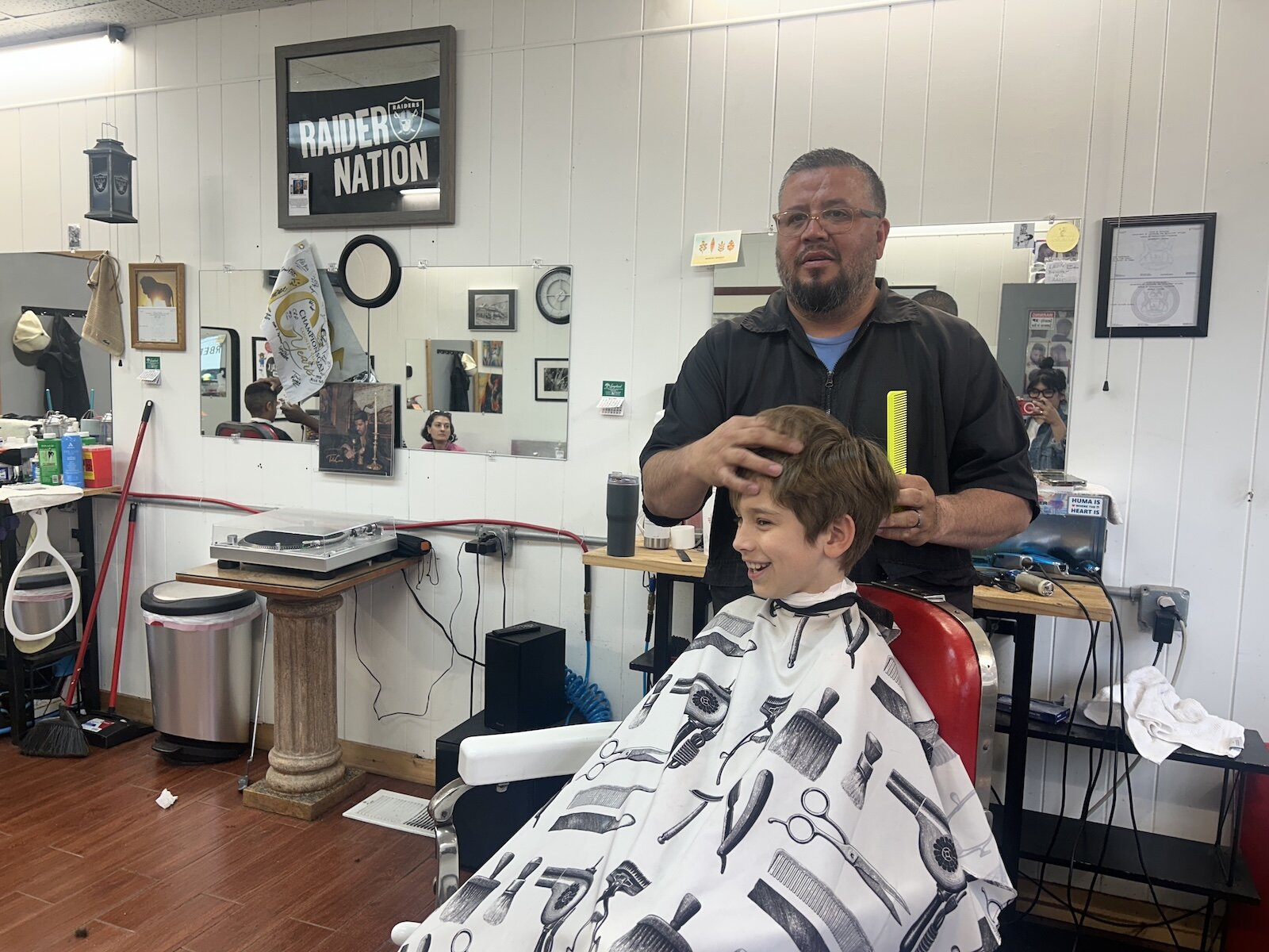 At Rob’s Barbershop young people were being encouraged to read along with their haircuts.