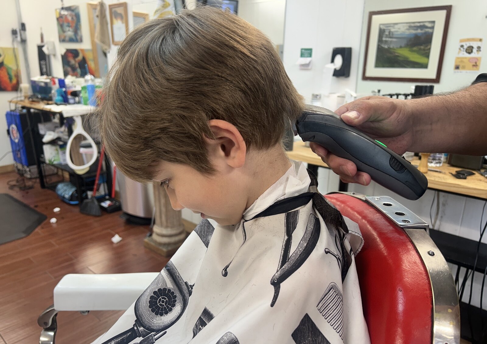 At Rob’s Barbershop young people were being encouraged to read along with their haircuts.