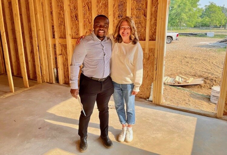Kalamazoo County Housing Director. Mary Balkema stands with developer Jamauri Bogan. Balkema says developers have enthusiastically promoted projects with the help of the counties new housing village.
