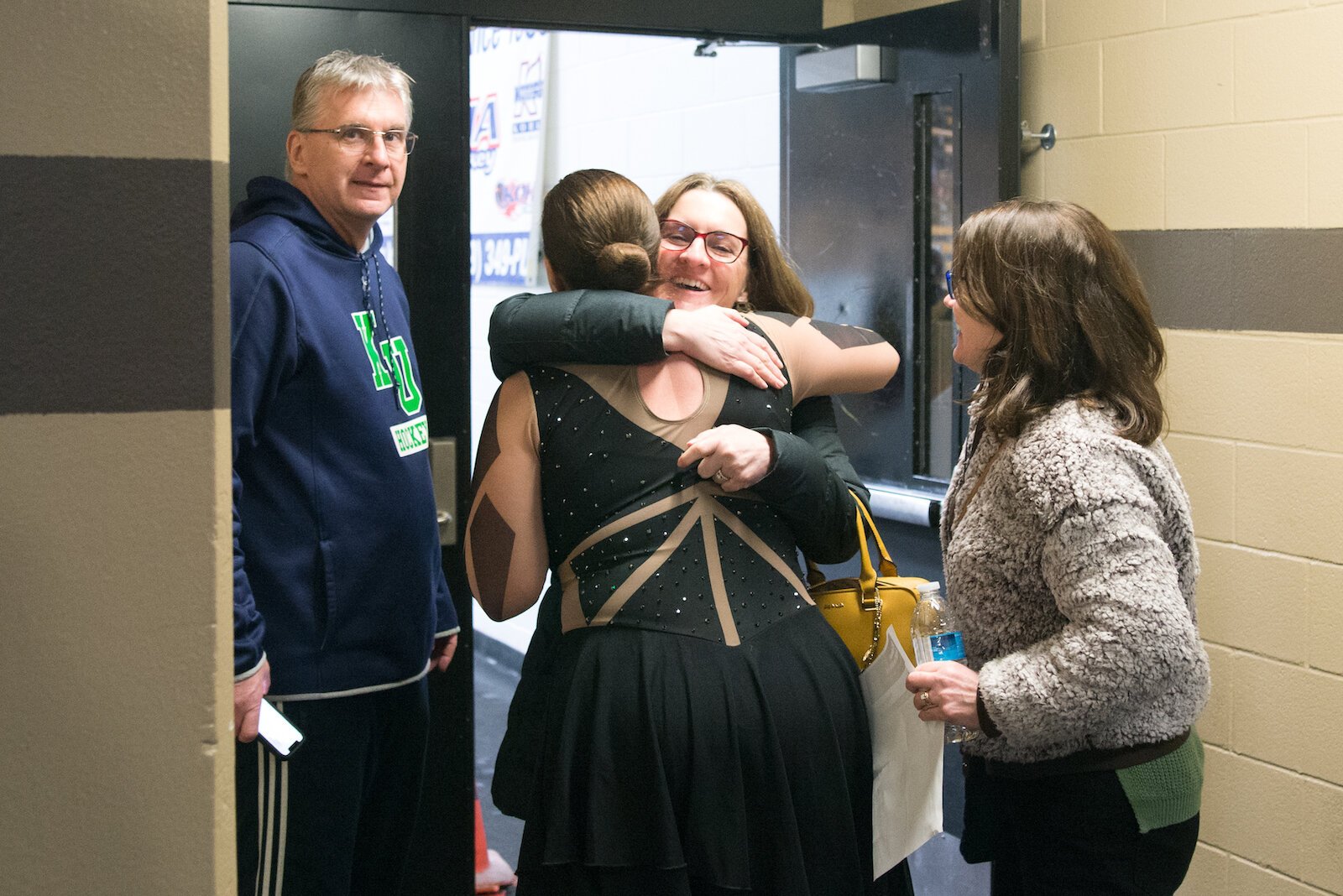 Friends and family greet skater Ronda Kuhnert after the performance.