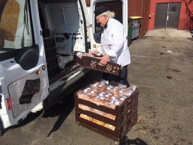 Judy Sarkozy loads up the bread.