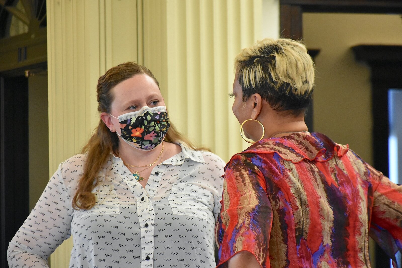 Kaytee Faris, Battle Creek City Commission member and Vice Mayor, talks with fellow Commission member Carla Reynolds prior to a recent meeting.