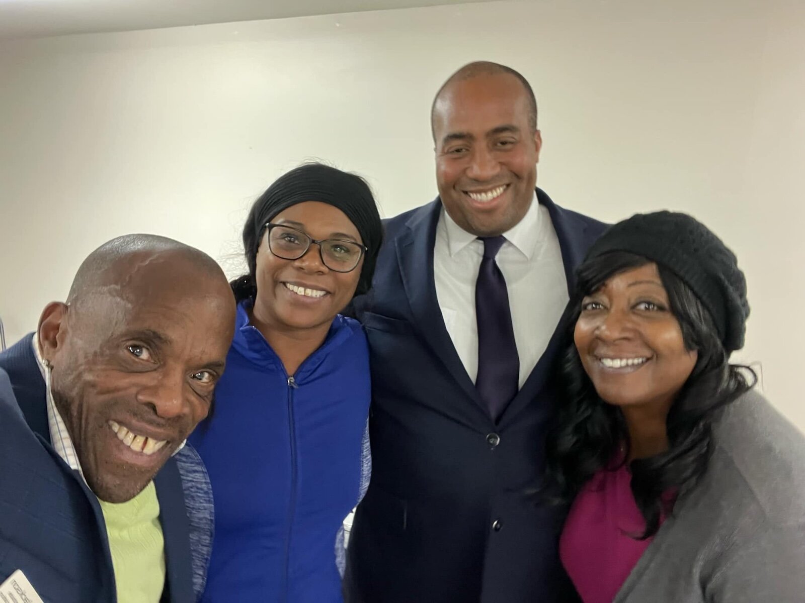 Arturo Puckerin, (second from right) with some of the neighborhood's staunch supporters.
