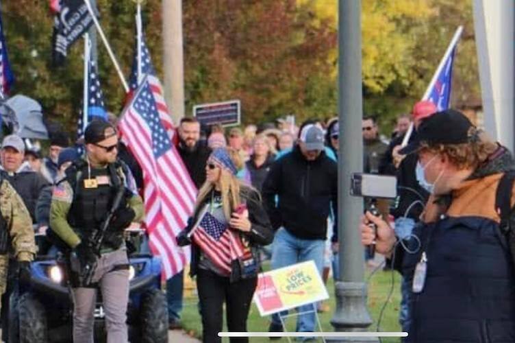 Kevin Live takes video of participants in a protest against the removal of a statue in Allendale.