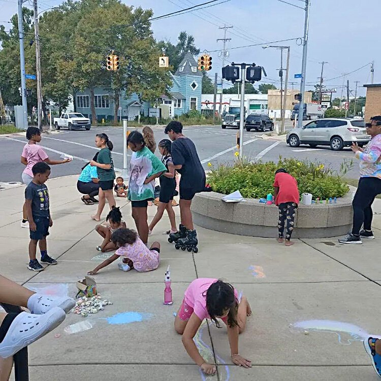 Children play on the site of the proposed pocket park.