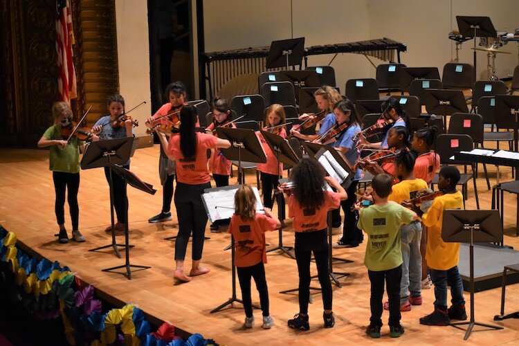 Kids in Tune violinists performing at Chenery Auditorium.