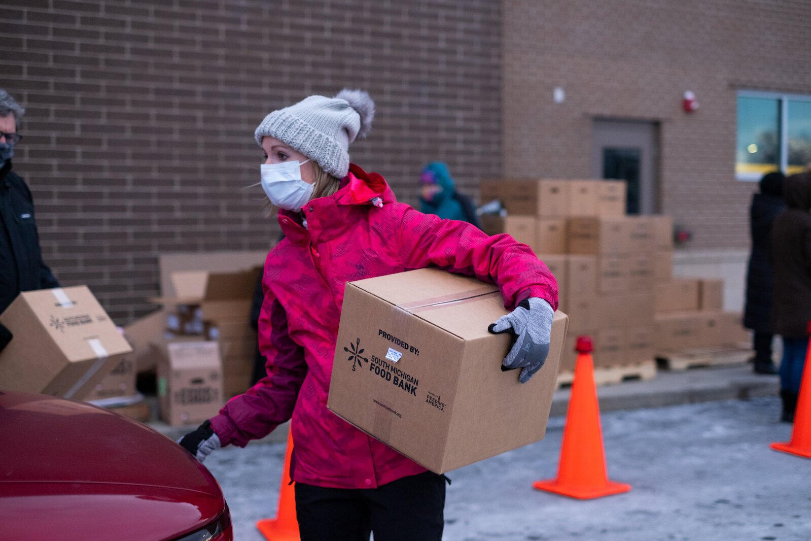 Kristine Nakashima helps distribute boxes of fresh food to those participating in the Fresh Food Pharmacy program.