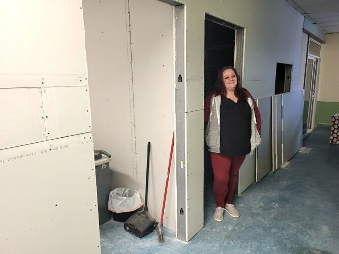 Lacey Kequom, Family Case Manager, stands near where the new SHARE office will be constructed. 