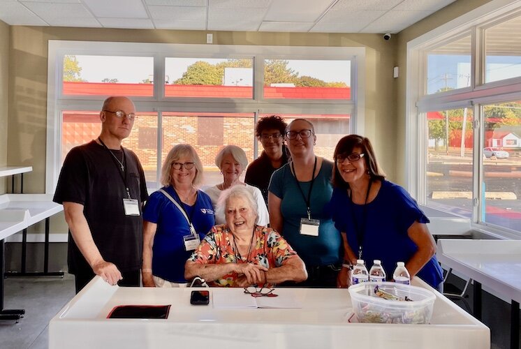 Pictured from left to right: Joddie Noblit, Emilie Cummins, Jeane Grabe, Conor Caswell, Schellie Caswell, Deacon Trish Harris. Seated is Bev Chase.