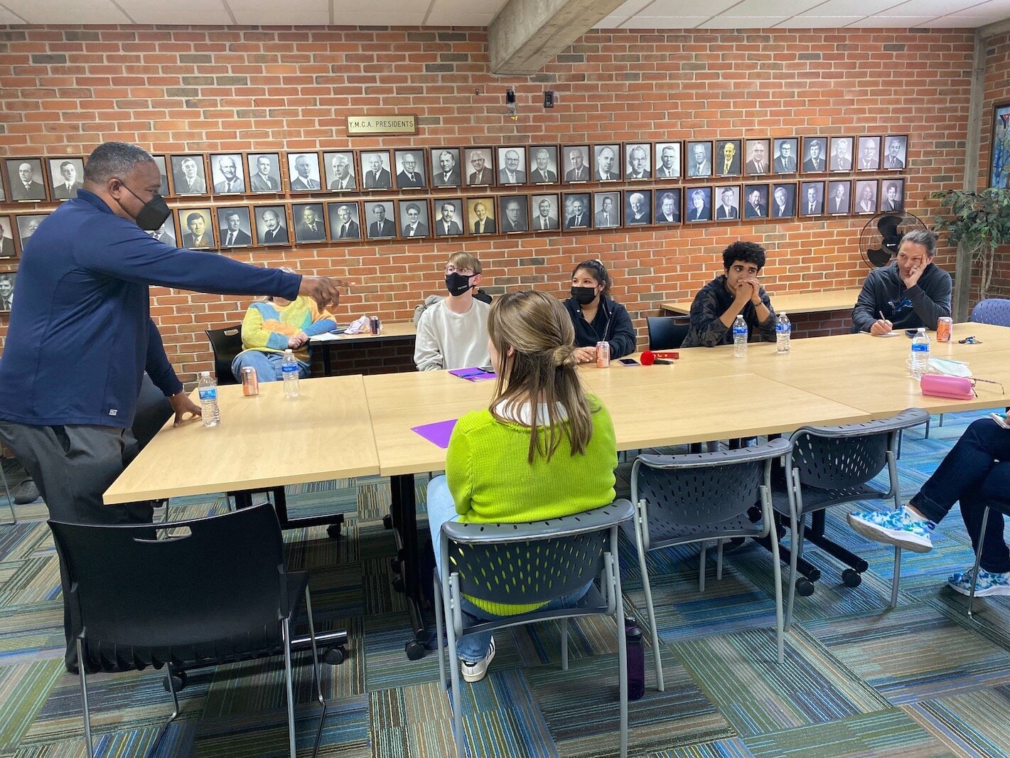 Victor Ledbetter talks to the participants in the Voices of Youth program about the role of police officers in the community and offers advice on how to interact with them.