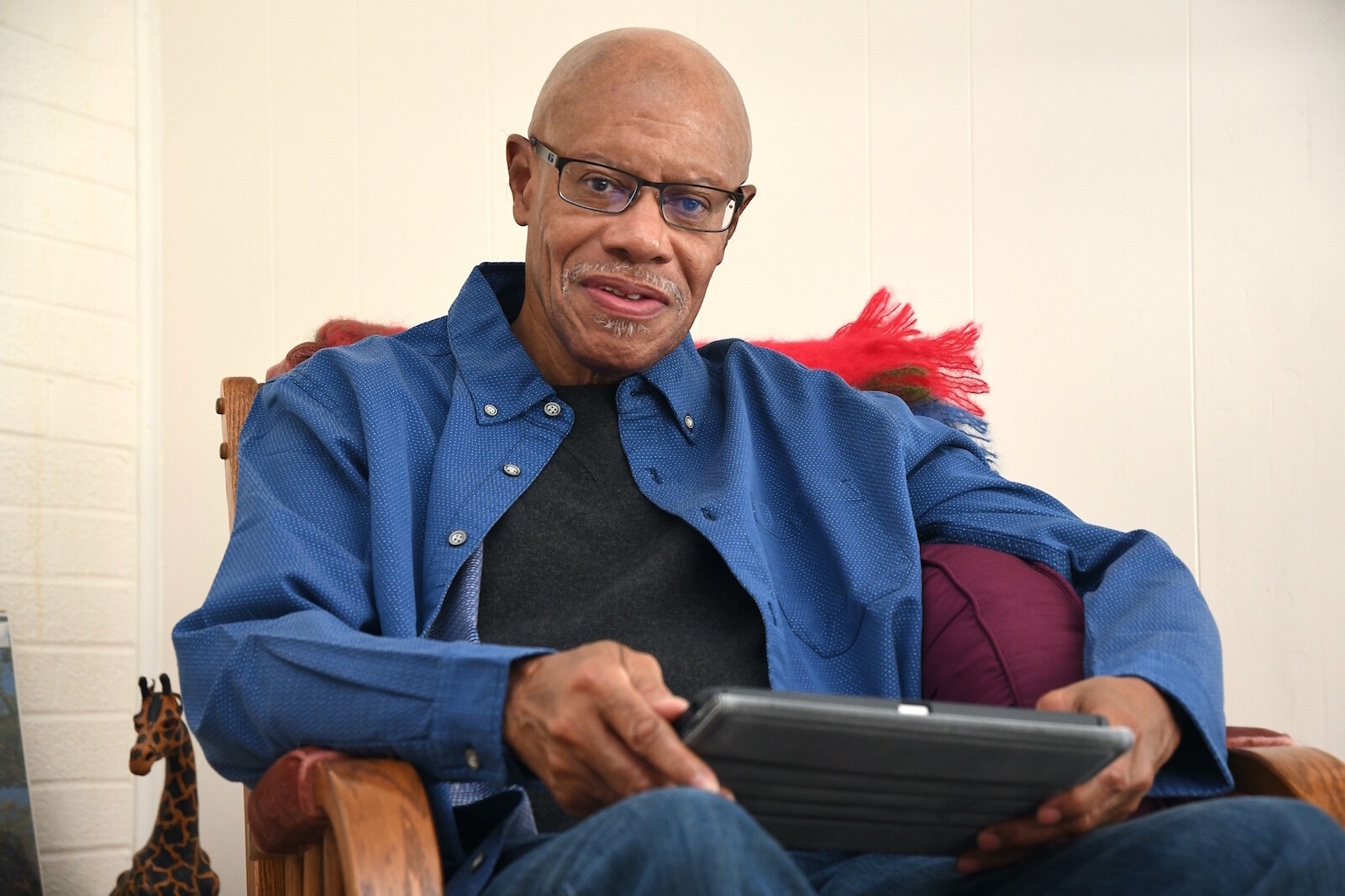 Leonard Harris does most of his reading on a tablet.