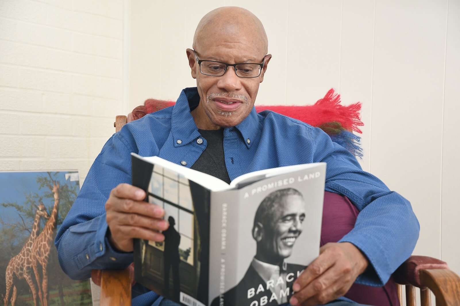 Leonard Harris is reading Barack Obama’s “A Promised Land.”