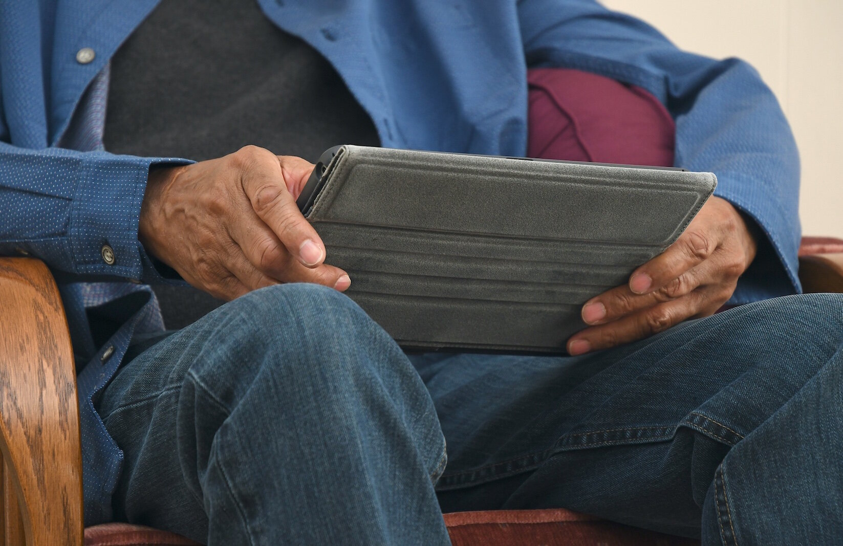 Leonard Harris does most of his reading on a tablet.