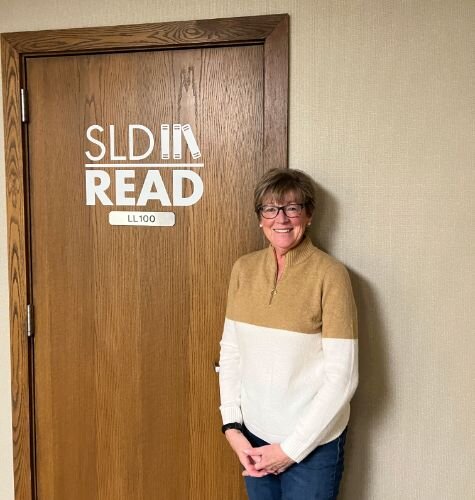 Tutor Linda Johnson outside the SLD Office.