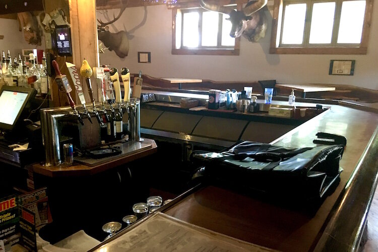 When it is allowed to reopen for sit-down business Louie’s tables will be positioned six feet apart, as they are shown here on the far side of the main bar area.