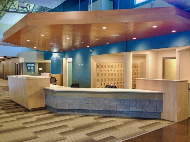 The service desk inside Ministry With Community is a hub for services, including mail, laundry, lockers and private showers.