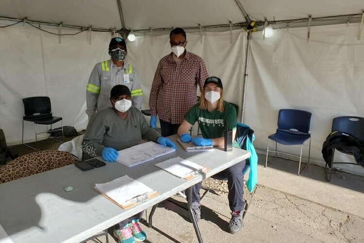 Maddie Odom with co-workers at the Michigan Fairground in Detroit where they are conducting drive through testing.