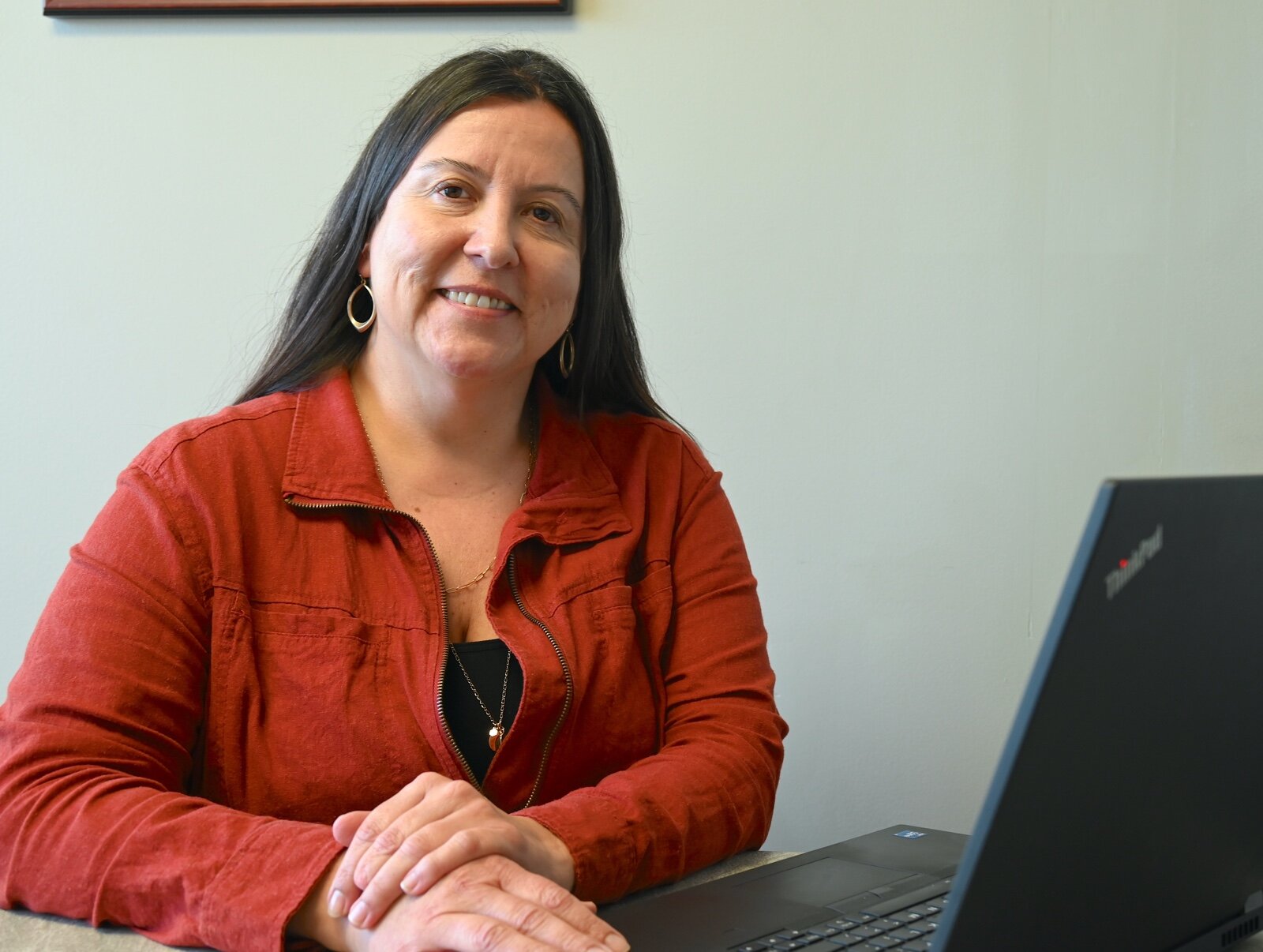 Maria Ortiz Borden, Co-Director at Pulse @ W.E. Upjohn Institute, is seen in the offices of VOCES in Battle Creek.