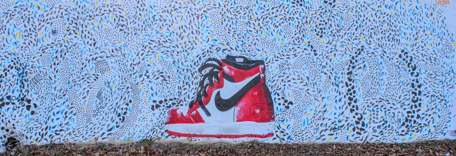 Jaziel Pugh's mural of a shoe can be seen on Dickman Road.  He painted the mural last summer as part of a Black Lives Matter ptoject.