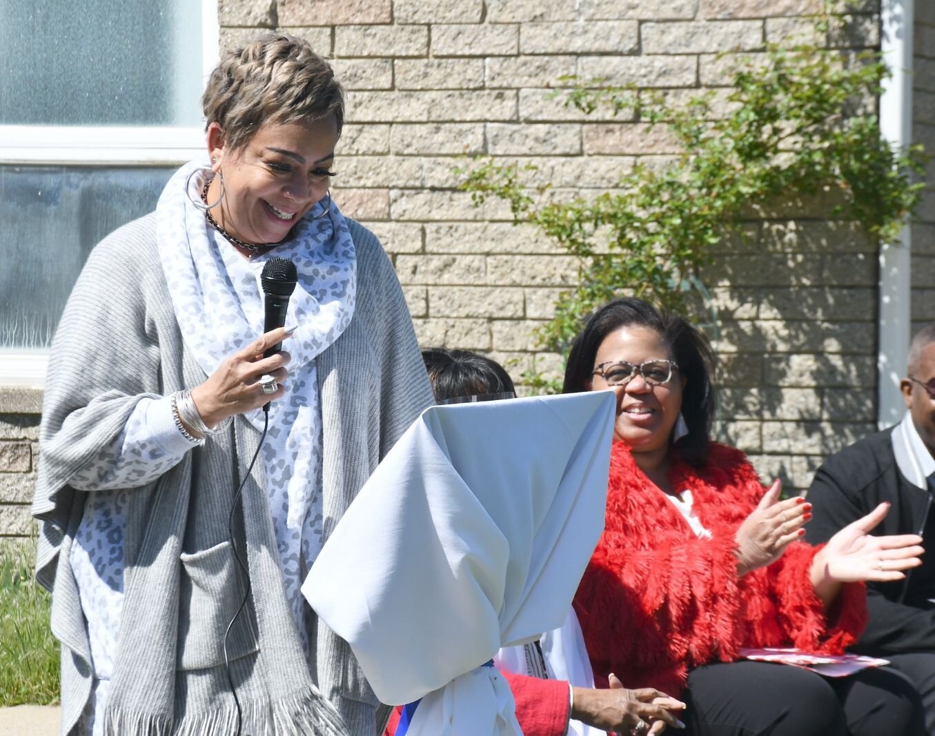 Carla Reynolds, Battle Creek City Commissioner, gives remarks on May 8, during the day of the unveiling of Honorary Mayor Maude Bristol-Perry Avenue.