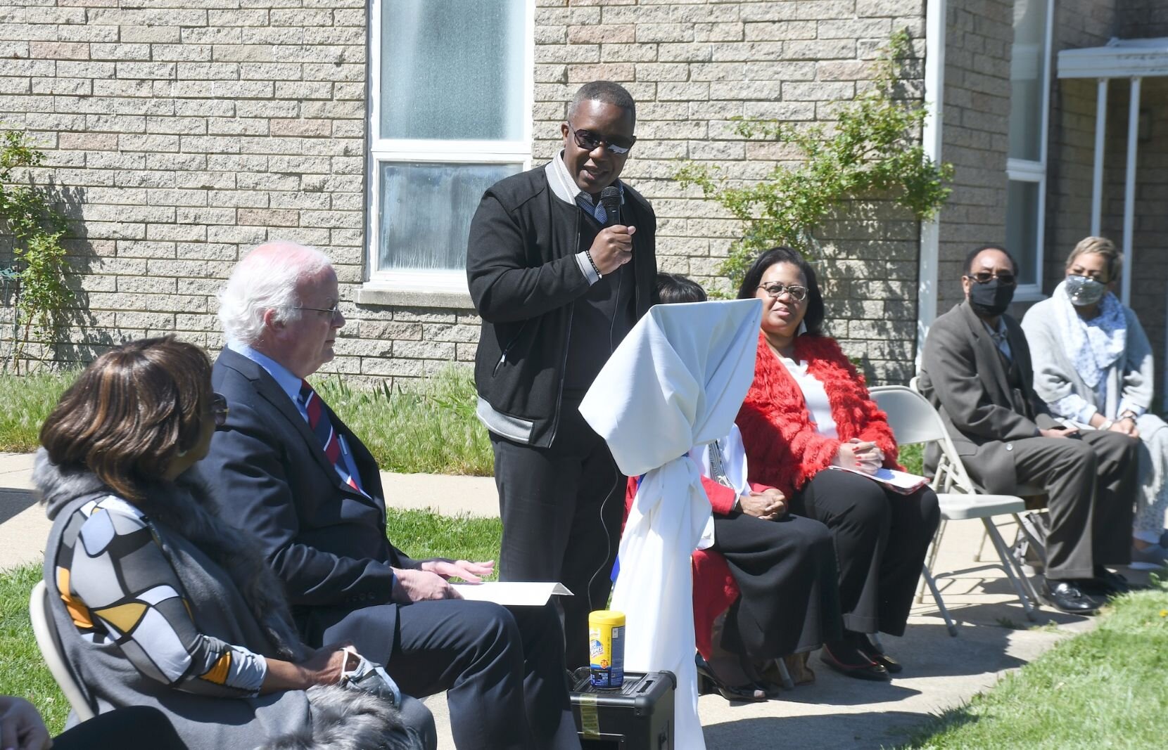Pastor Chris McCoy gives remarks on May 8, during the day of the unveiling of Honorary Mayor Maude Bristol-Perry Avenue.