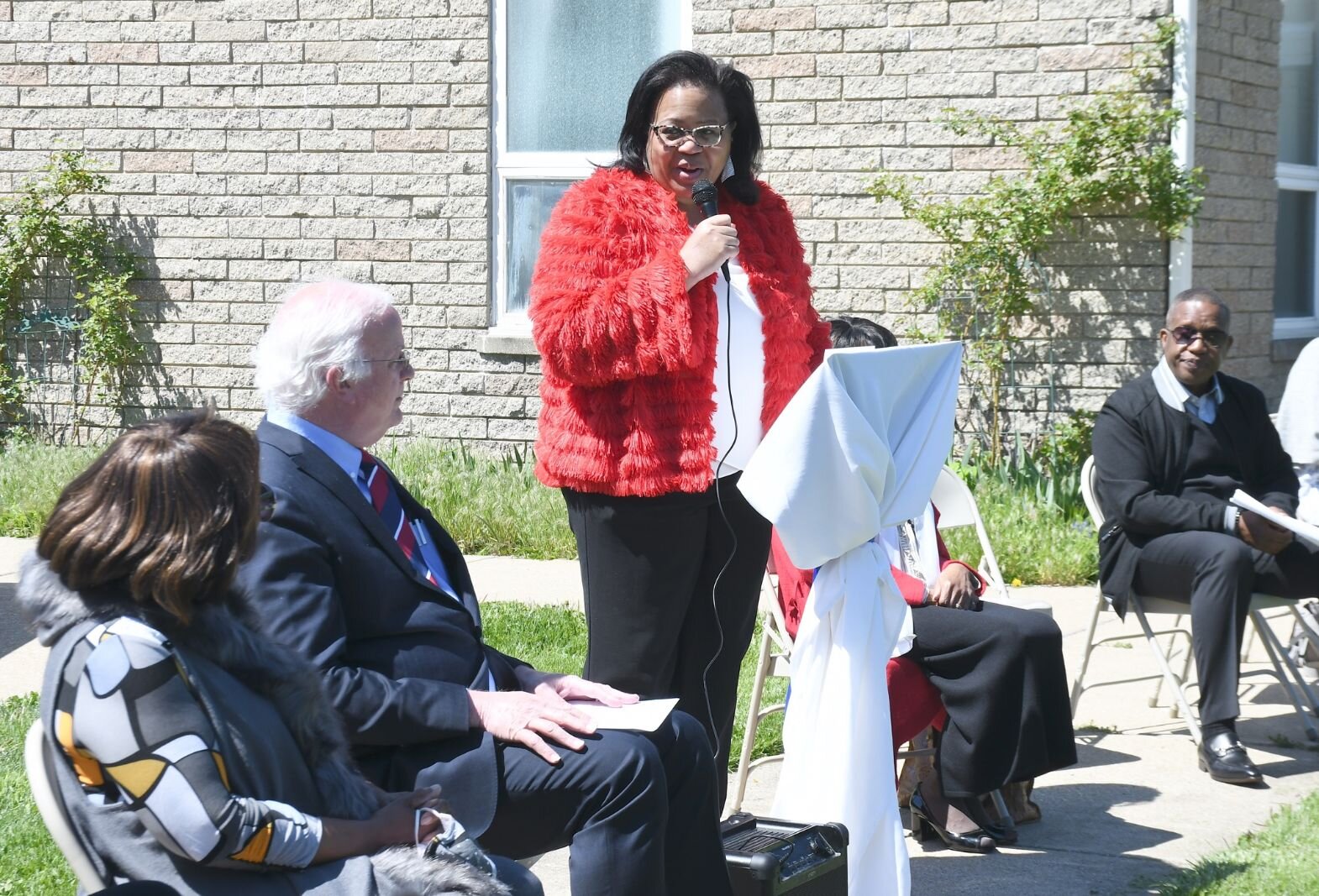 Lynn Ward Gray of the Battle Creek Community Foundation gives remarks on May 8, during the day of the unveiling of Honorary Mayor Maude Bristol-Perry Avenue.