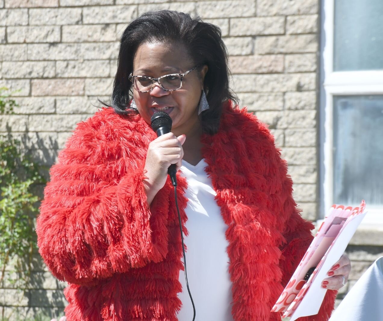 Lynn Ward Gray of the Battle Creek Community Foundation gives remarks on May 8, during the day of the unveiling of Honorary Mayor Maude Bristol-Perry Avenue.