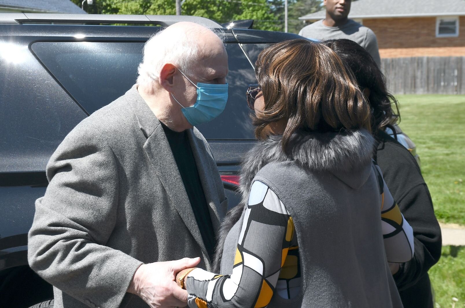 Community leader Pete Christ greets Maude Bristol-Perry on May 8.