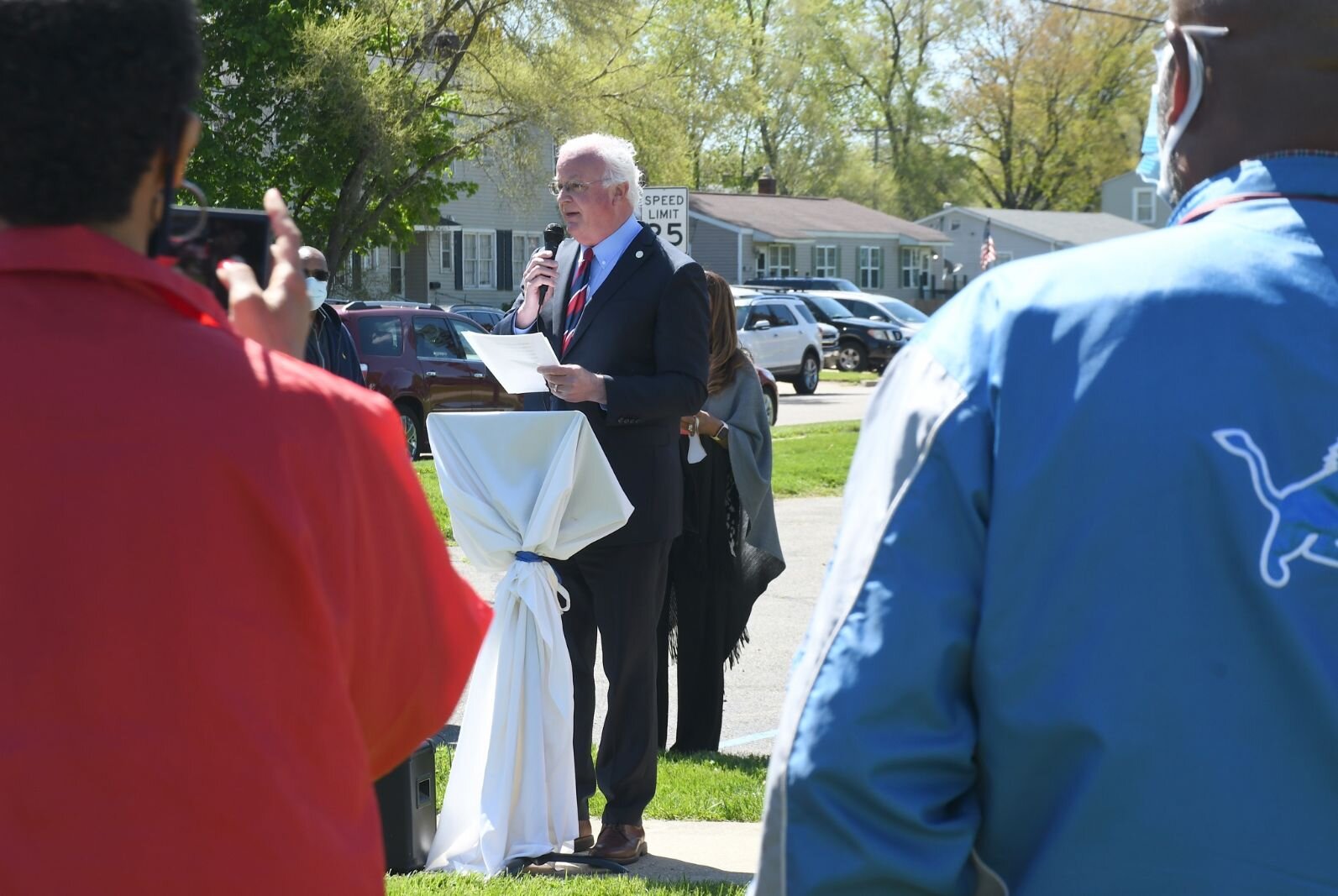 Battle Creek Mayor Mark Behnke gives remarks on May 8, during the day of the unveiling of Honorary Mayor Maude Bristol- Perry Avenue.